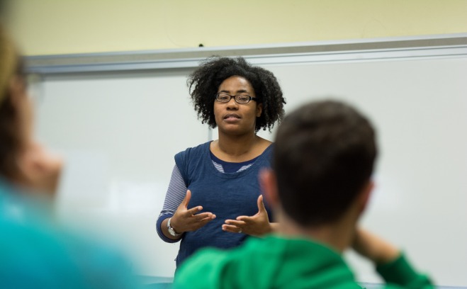 DeMisty Bellinger-Delfeld from English Studies teaching in front of a classroom