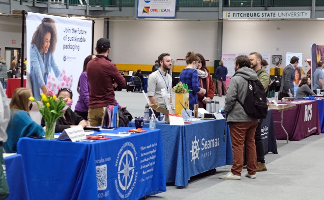 Employer tables at career fair in rec center