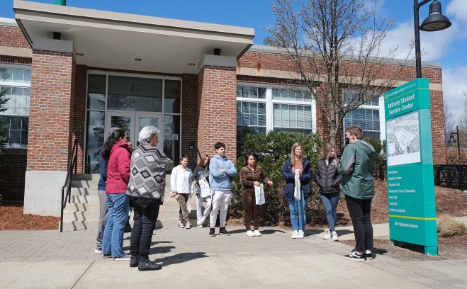 Tour group outside Anthony Student Center on a bright sunny spring day