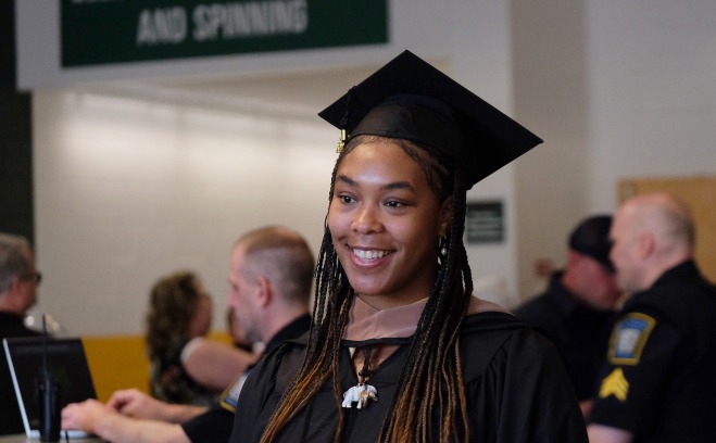 female student at graduate commencement 