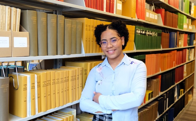 Student in library stacks