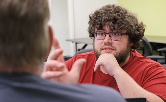 CPS AP Class two male students talking