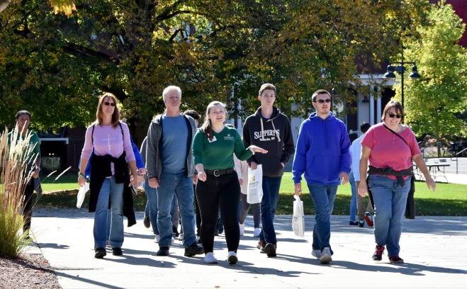 Tour group on the quad with female tour guide