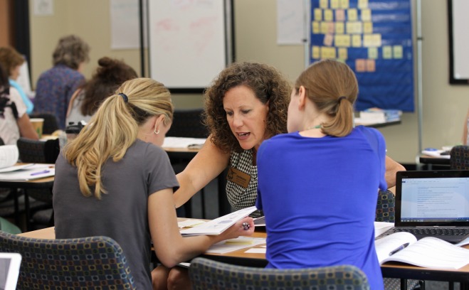 Wilson course instructor teaching female students in the classroom