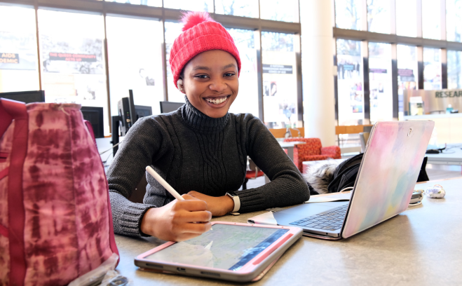 Photo of student in campus library