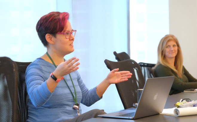 Two women at a conference table 