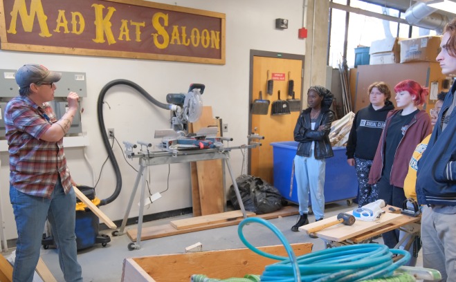 Technical theater shop instructor and students