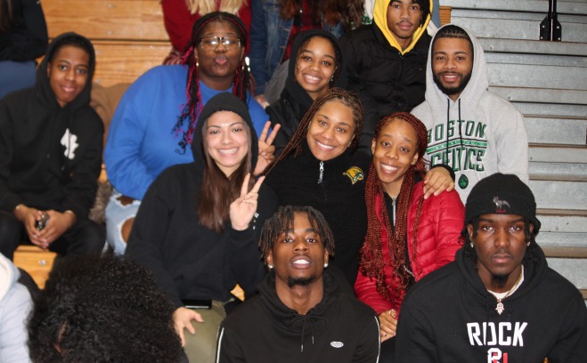 Students at basketball game in stands