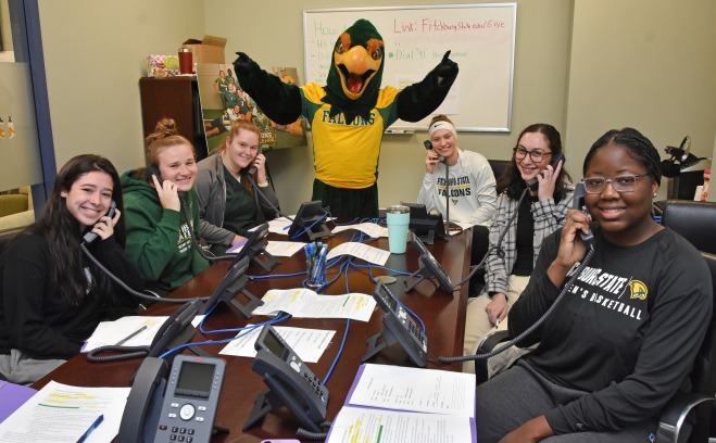 Go Falcons Challenge student athletes and Freddy working the phones