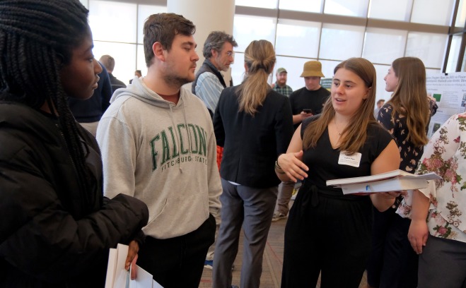 Undergraduate Research Conference student presentations in the main lounge of Hammond