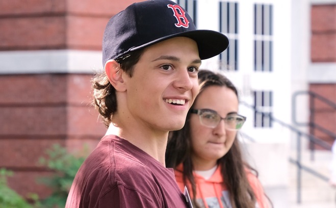 Male and female student at orientation on quad