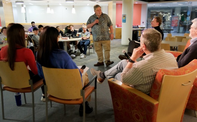 Faculty and students speaking at business honor society in Falcon Hub