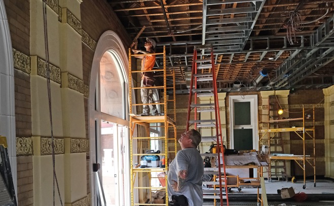 Worker and supervisor in Thompson Hall lobby