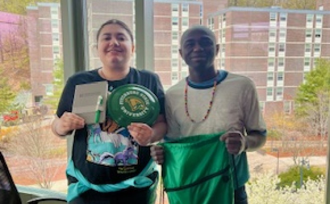 MAICEI students on campus in Hammond Hall with swag