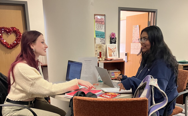 ACT student and tutor at table in office in Hammond