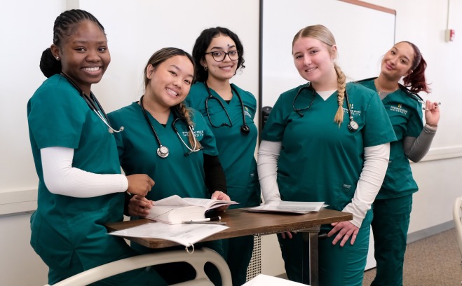 Female nursing students in sim lab