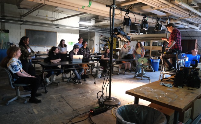 Tech theater class being instructed backstage