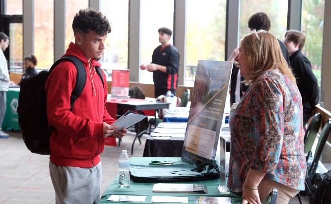 SGOCE and student at the Graduate Fair in Hammond Hall Main Lounge