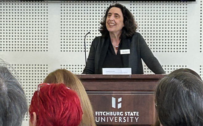 Franca Barricelli speaking at podium at CIC conference.