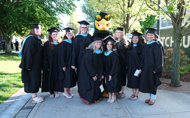 Group of graduate students with Freddy Falcon