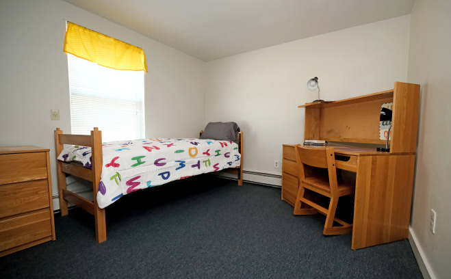 A bedroom in the family housing unit