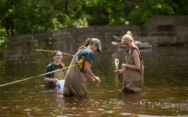 environmental bio students in river