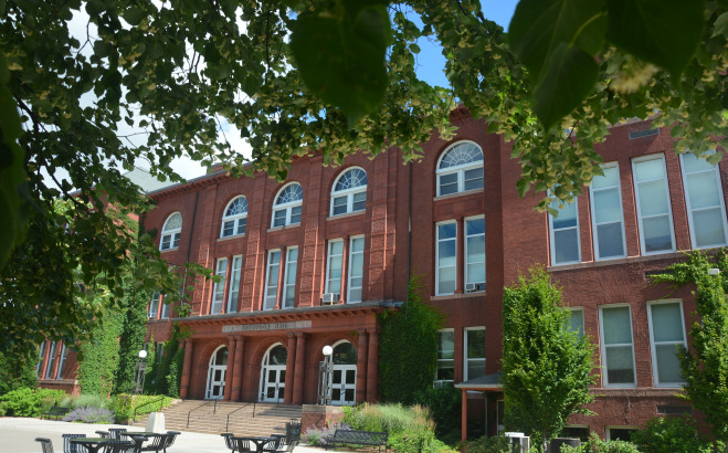 Thompson Hall exterior with leaves