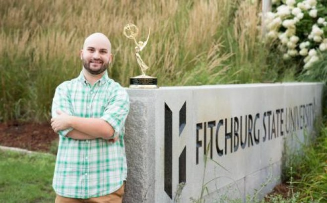 Comm media student with his Emmy