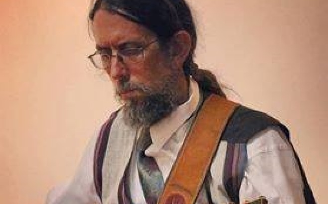 Eddy Troxler playing guitar.