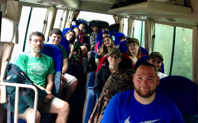 Falcons traveling in a bus while visiting another country 