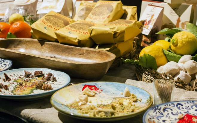 Plates and different foods on a table in Italy