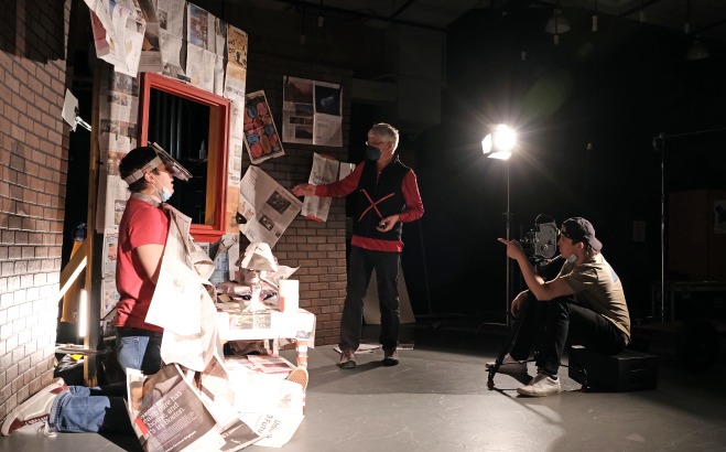 Film students with teacher in the studio