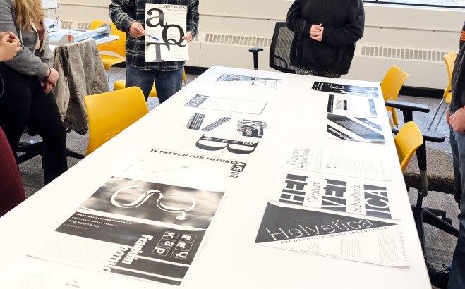 Professor Donald Tarallo reviews his student's work in their Typography Class