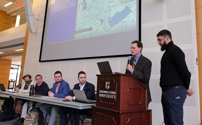 Josh Spero and panel of students and faculty at Ukranian talk in main lounge