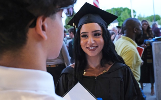 Female graduate student outside rec center