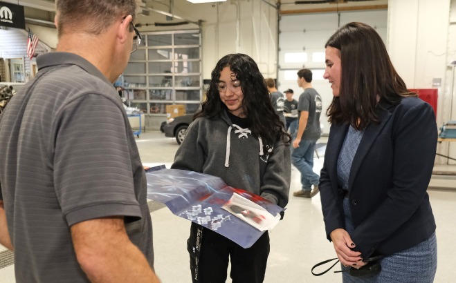 Monty Tech shop student with teacher and principal