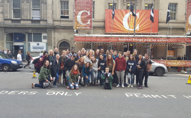 Group of students outside theater on a theater study abroad trip