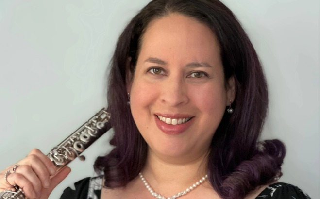 Maria Ramey community music instructor with flute.