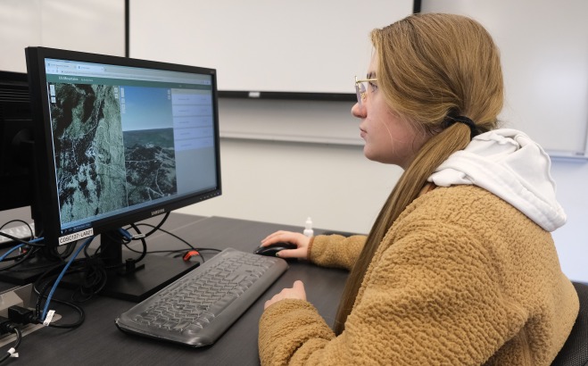 Girl on computer in a classroom