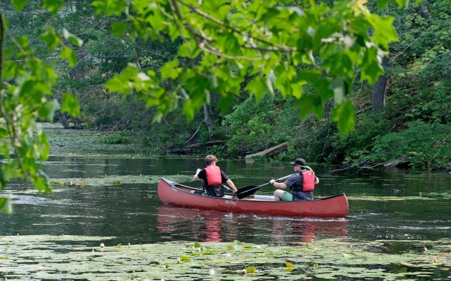 Students in canoe on Grove Pond in Ayer