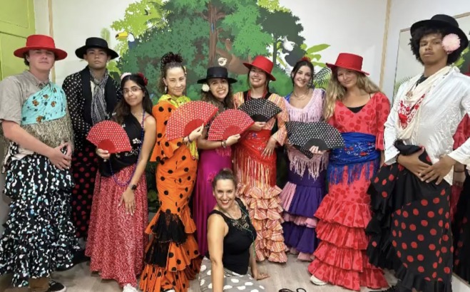 Giancarlo with a group of people ina flamenco class 