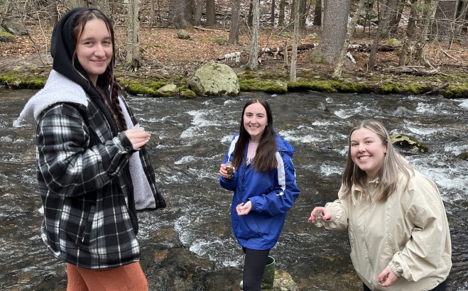 Students collecting samples in the Nashua River
