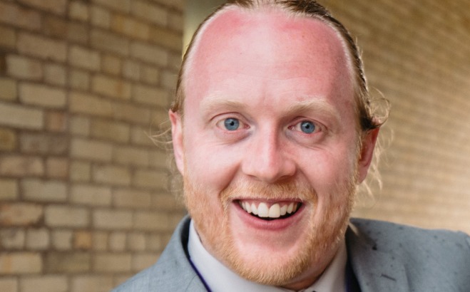 Andrew Pottorff in suit at wedding UBMS