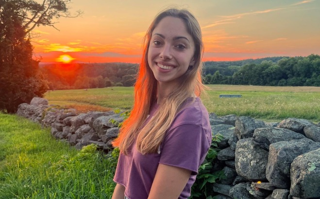 Autumn Garceau ACT in a field with sunset