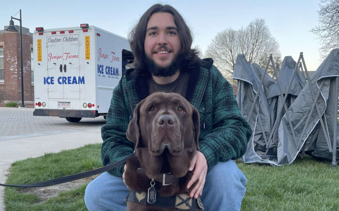 Jonathan Rajotte ACT outside with his dog.