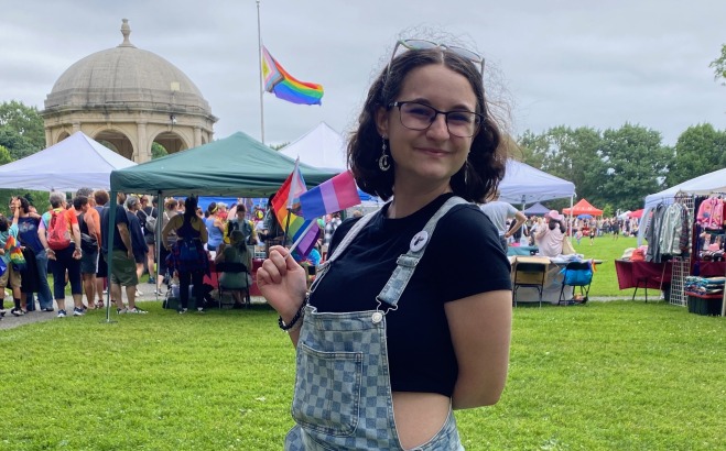Ahna Gainey ACT outside at fair with pride flag