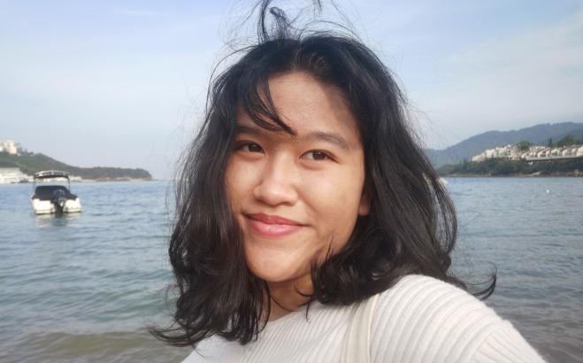 Nadine Simamora ACT tutor at ocean hair blowing