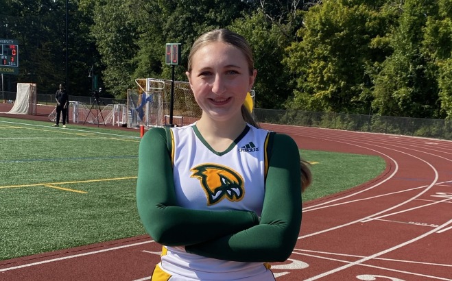 Samantha Wozniak ACT tutor on track in cheerleading uniform