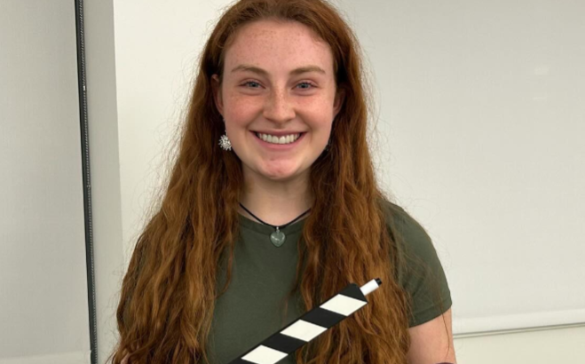 Cassie Israelson holding a move clapboard