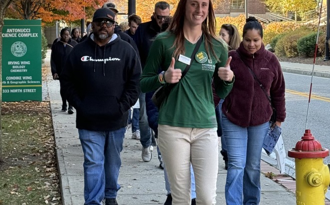 Skye Goba tour guide giving a tour during future falcon day on North St.